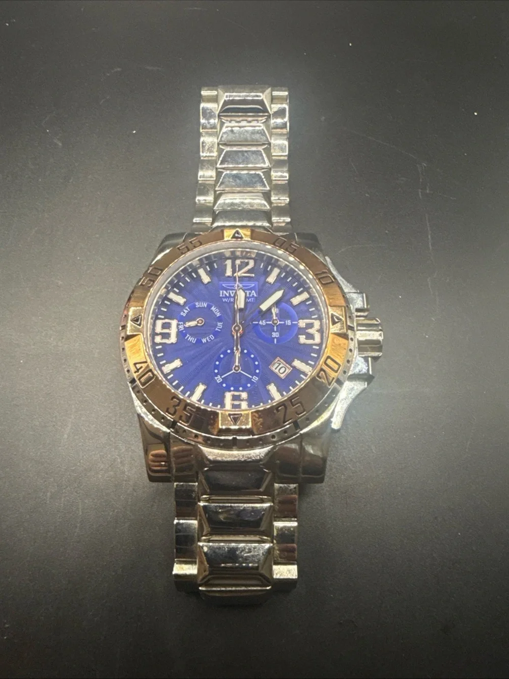 Invicta Silver and Blue Chronograph Watch with Gold Bezel